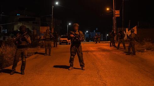 Two IDF soldiers wounded in West Bank stabbing attack during weapons raid