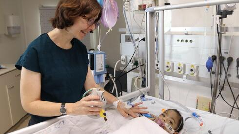 Woman whose father died waiting for liver donor gives part of her liver to baby she never met