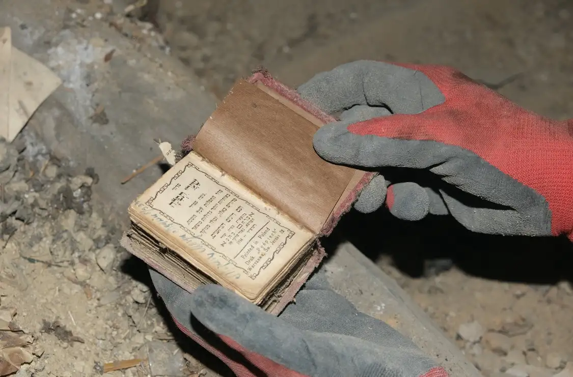Star of David armband and 1930s siddur found hidden in former Ghetto building