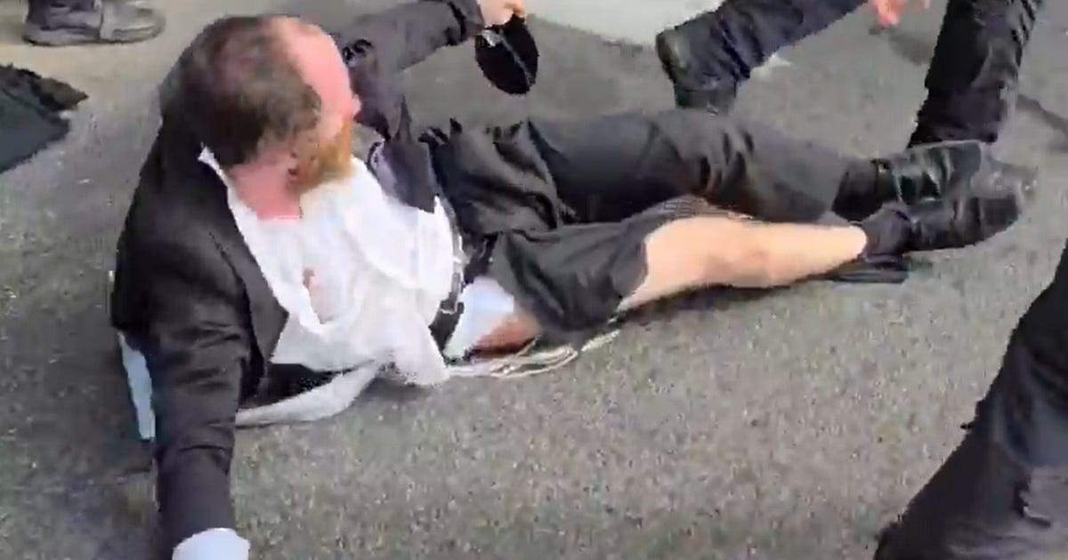 Israel Police use batons, stun grenades on Haredi protesters blocking key road; Five arrested