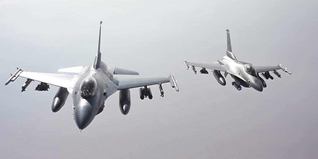 Air Force F-16 fighter jets refuel while flying over the Middle East | Fox News Video