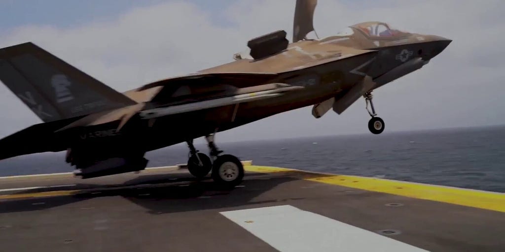US fighter jets take off and land aboard USS Tripoli in Middle East | Fox News Video