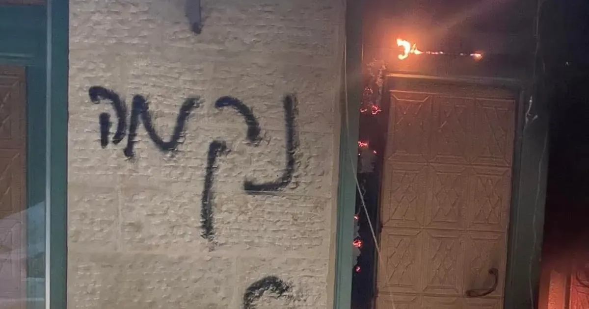 Palestinian reports: Israeli settlers torch, grafitti two mosques in West Bank villages