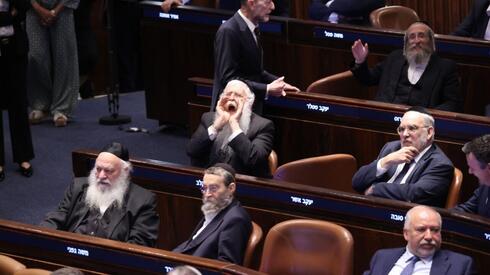 Law freezing arrests of Haredi draft evaders passes Knesset as Netanyahu absent from vote