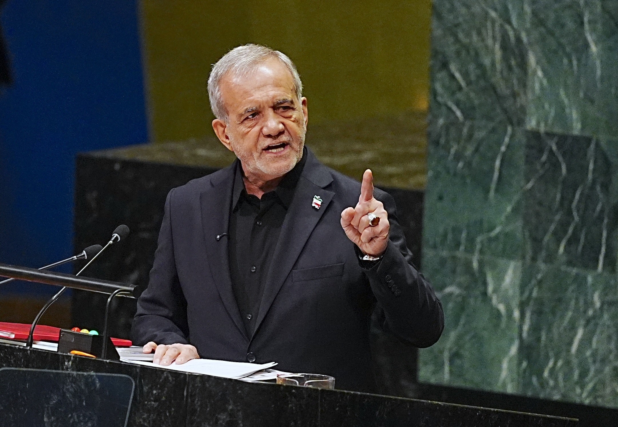 Iran won’t bow to military action or sanctions and will retain nuclear program, country’s president tells UNGA