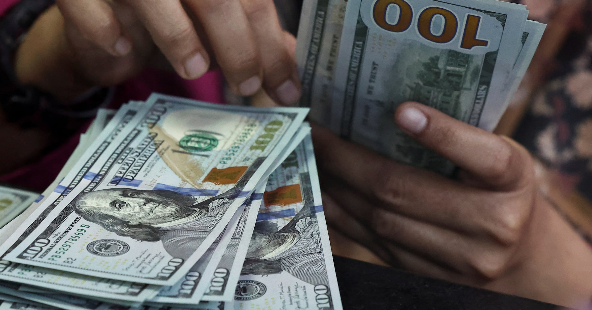 Dollar holds near 2-month high as markets weigh rate hikes, Iran diplomacy
