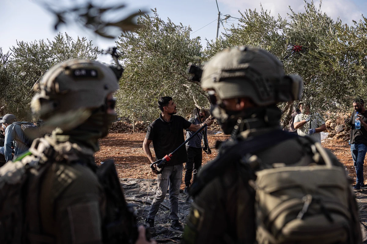 With Israelis facing a national election and Palestinians kicking off their month-long olive harvest, the West Bank has become a battleground. Israeli settlers have repeatedly attacked Palestinian villagers, journalists and international visitors.