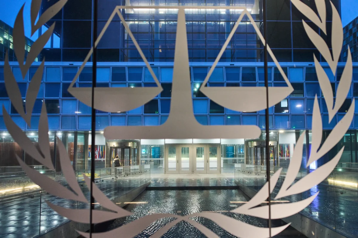 The Trump administration imposed aggressive sanctions on the International Criminal Court, just hours after a former judge on the court was awarded the Nobel Peace Prize.